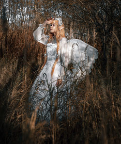 Side view of woman in forest