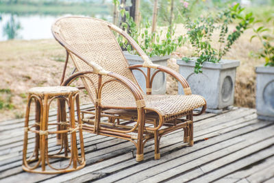 Empty chairs and table against wall