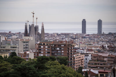 High angle view of buildings in city against sky