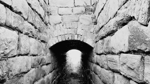 Shadow of old wall in tunnel