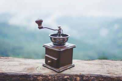 Close-up of coffee grinder on table