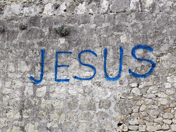 Close-up of text on wall