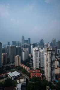 High angle view of buildings in city against sky