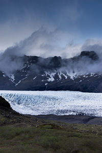 Scenic view of landscape against sky during winter