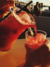 Close-up of hand holding drink