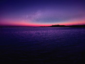 Scenic view of sea against sky at night