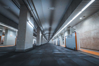 A dim passageway in a subway station