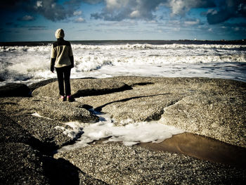 Woman standing on beach