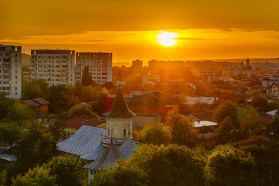 High angle view of buildings against sky during sunset