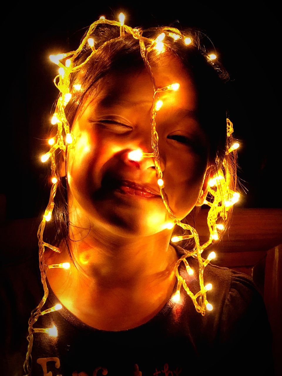 PORTRAIT OF WOMAN WITH ILLUMINATED CANDLES