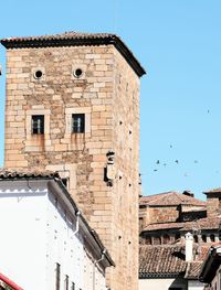 Low angle view of old building against clear sky