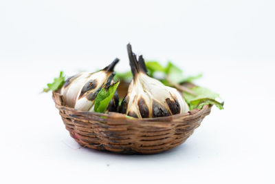 Close-up of basket against white background