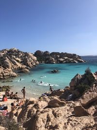 Scenic view of beach against clear sky