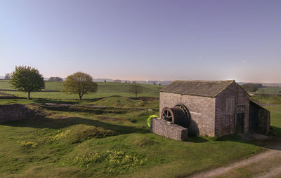 Scenic view of field against clear sky