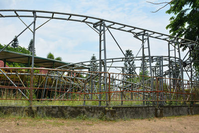 Low angle view of metallic structure against sky