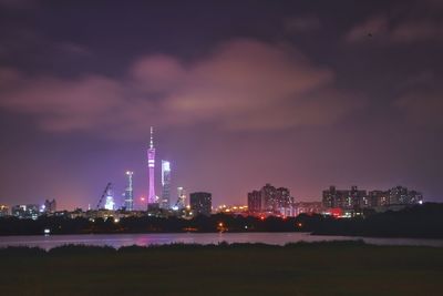 Illuminated buildings in city at night