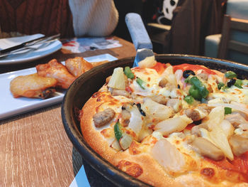 Close-up of pizza served on table