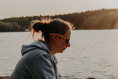 Portrait of mid adult man looking at lake