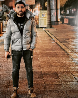 Portrait of man standing on street