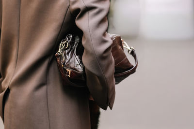 Midsection of woman wearing hat