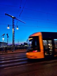 Blurred motion of car on road in city