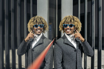 Young man looking away wearing sunglasses