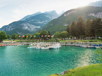 Moleno town and blue lake at the foot of the brenta dolomites, western trentino alto adige in italy