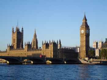 View of bridge over river with buildings in background