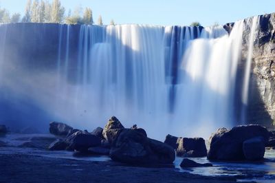 Panoramic view of waterfall in sea