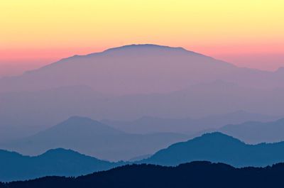 Scenic view of silhouette mountains against clear sky