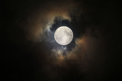 Low angle view of moon against sky at night