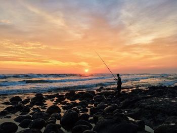 Scenic view of sea at sunset