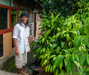 Portrait of smiling young man standing outdoors