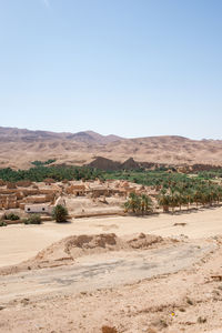 Scenic view of desert against clear sky