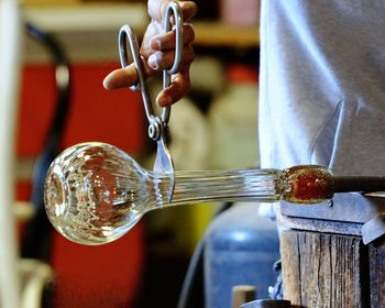 Close-up of hand pouring water