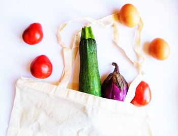 High angle view of vegetables on table against white background