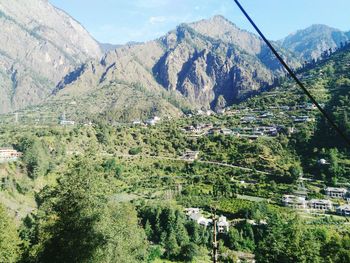 High angle view of trees and mountains against sky