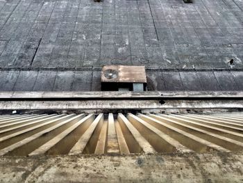 High angle view of air duct by old wall