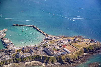 High angle view of buildings by sea