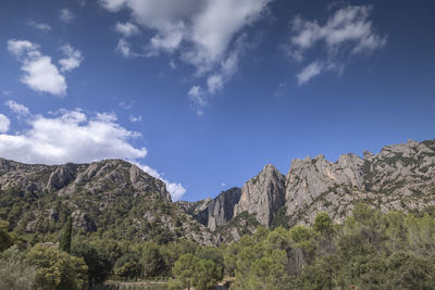 Low angle view of rocks against sky