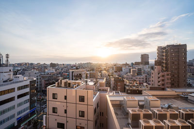 High angle view of buildings in city against sky