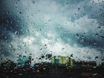 Full frame shot of wet glass window in rainy season