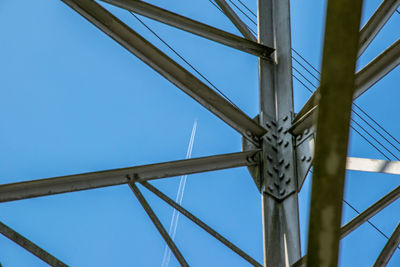 Low angle view of bridge against clear blue sky
