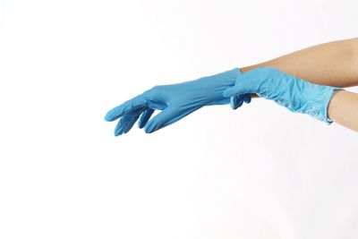 Close-up of hands over white background