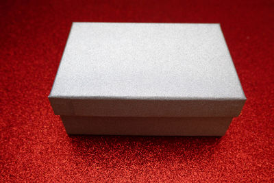 High angle view of paper on white surface