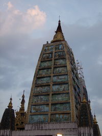 Low angle view of cathedral against cloudy sky