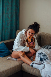 Woman with dog at home