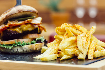 Close-up of burger and vegetables on table