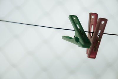 High angle view of clothespins hanging on clothesline