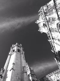 Low angle view of building against cloudy sky